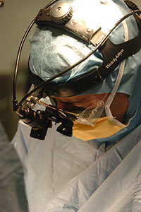 physician performing surgery